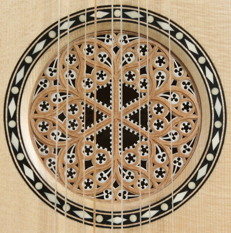 Stradivari guitar rose with surrounding inlay